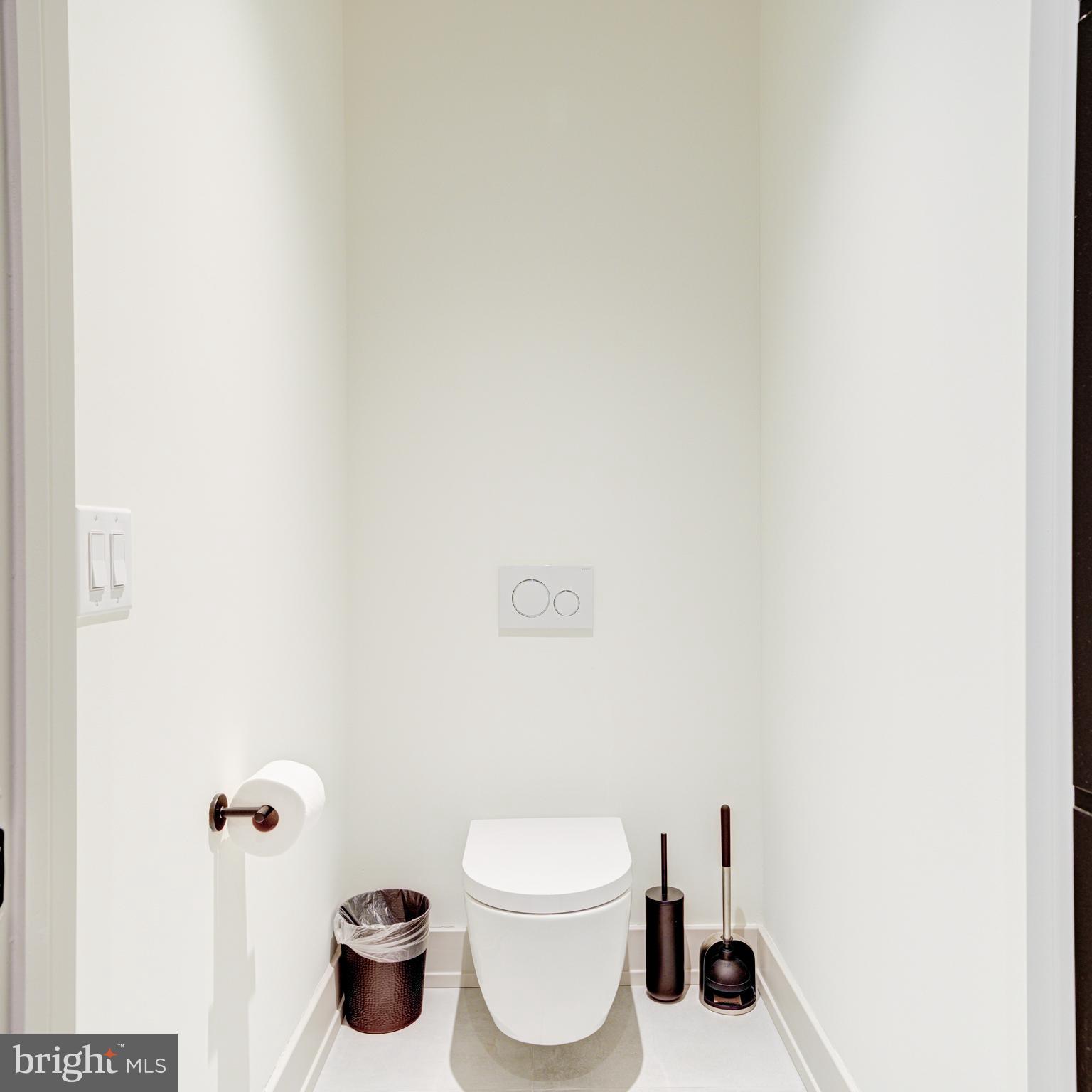 109 South 24th Street Philadelphia, PA 19103 - Photo 27 of 55 a bathroom with a toilet and a shower curtain