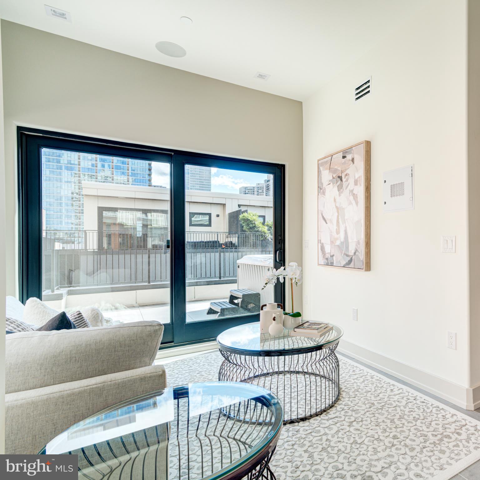 109 South 24th Street Philadelphia, PA 19103 - Photo 29 of 55 a living room with furniture and a window