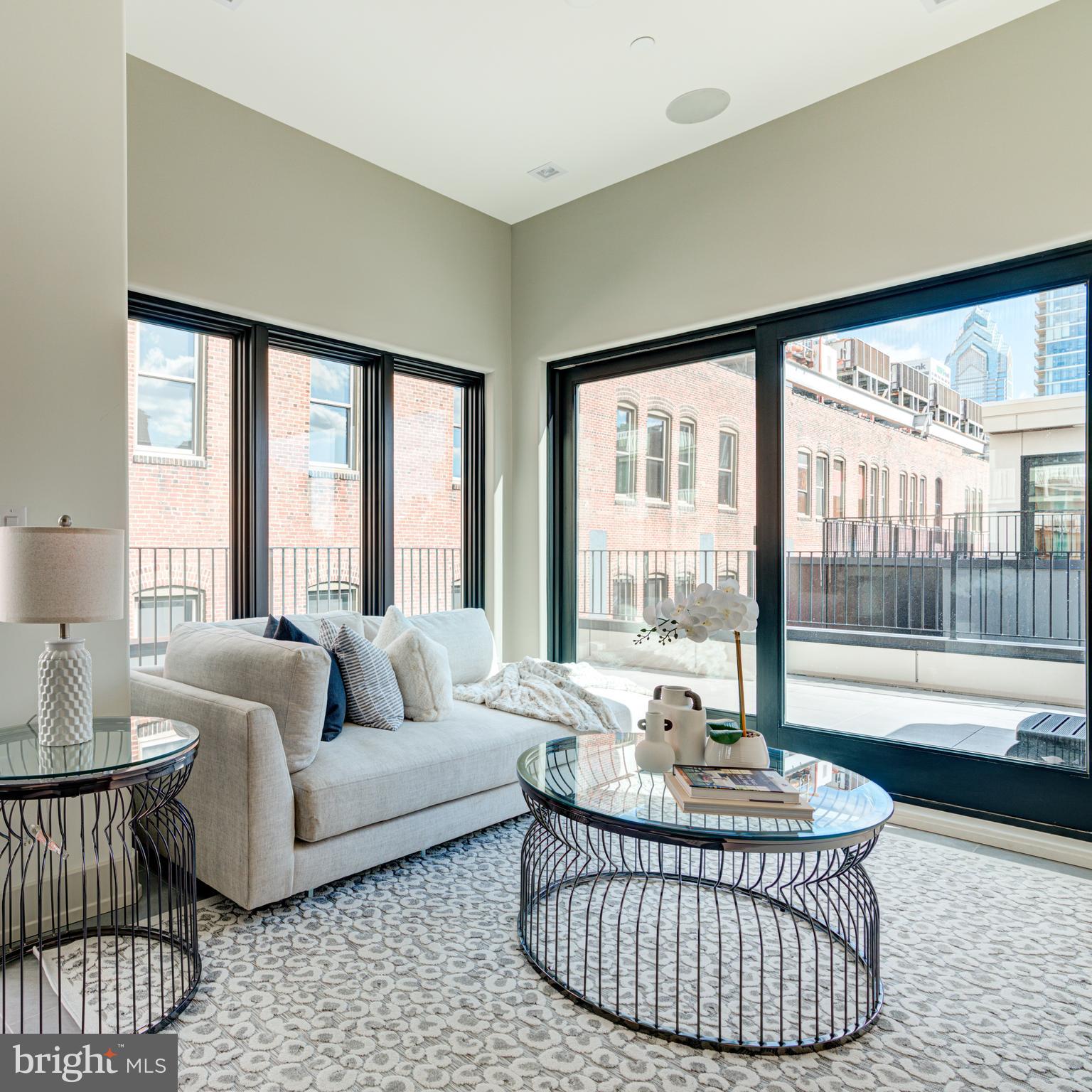 109 South 24th Street Philadelphia, PA 19103 - Photo 30 of 55 a living room with furniture and a large window