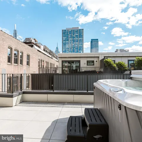 a bedroom with a large bed and a couch