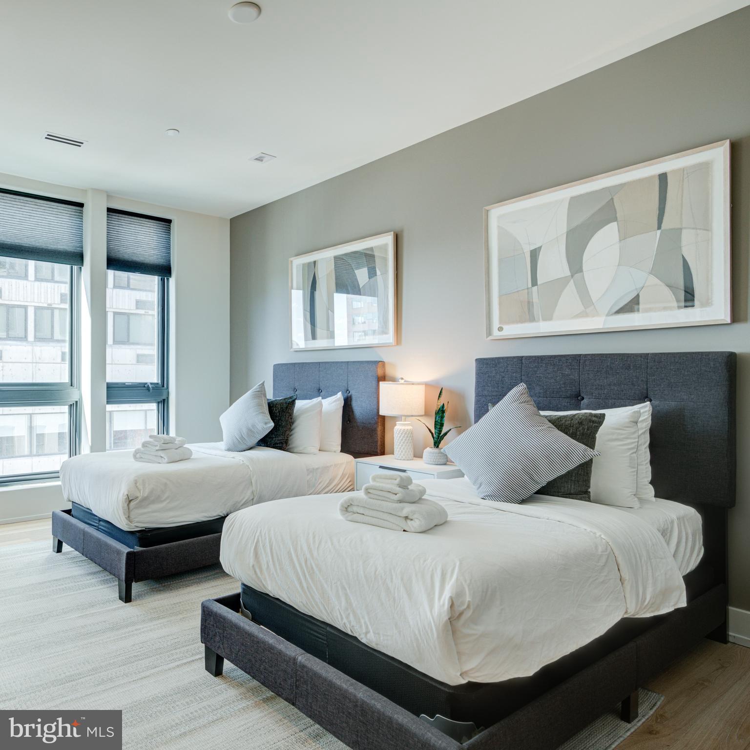 109 South 24th Street Philadelphia, PA 19103 - Photo 42 of 55 a bedroom with bed and window