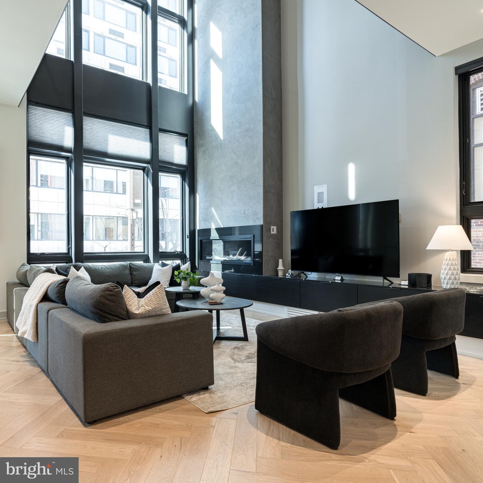 109 South 24th Street Philadelphia, PA 19103 - Photo 10 of 55 a living room with furniture and a flat screen tv