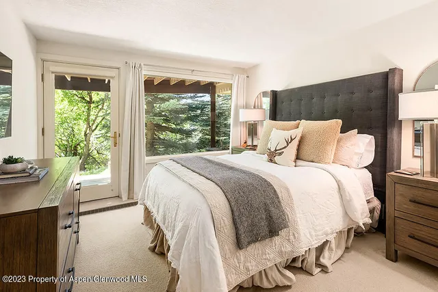 a bedroom with a bed and a couch