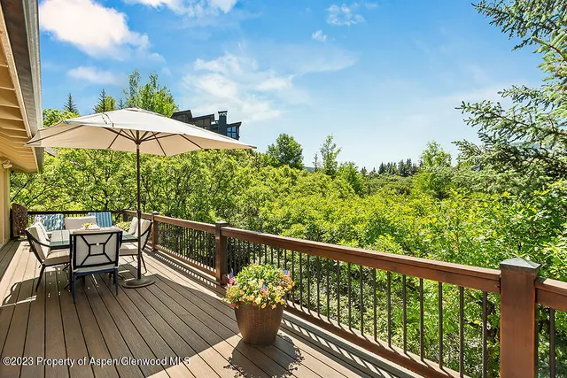 a view of balcony with furniture and wooden floor