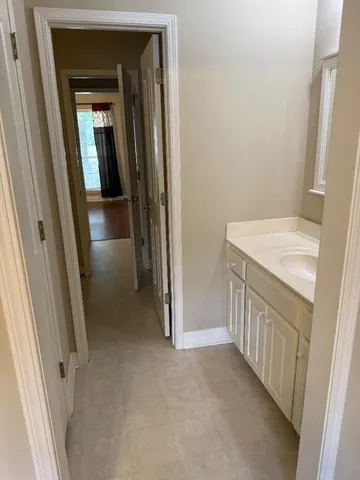 a view of a hallway and a sink
