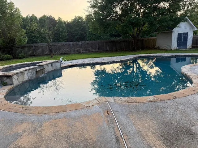 a view of swimming pool with a yard
