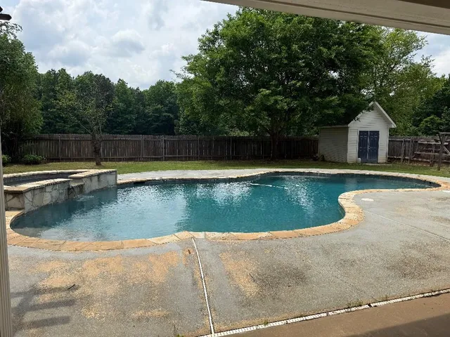 a view of a house with swimming pool