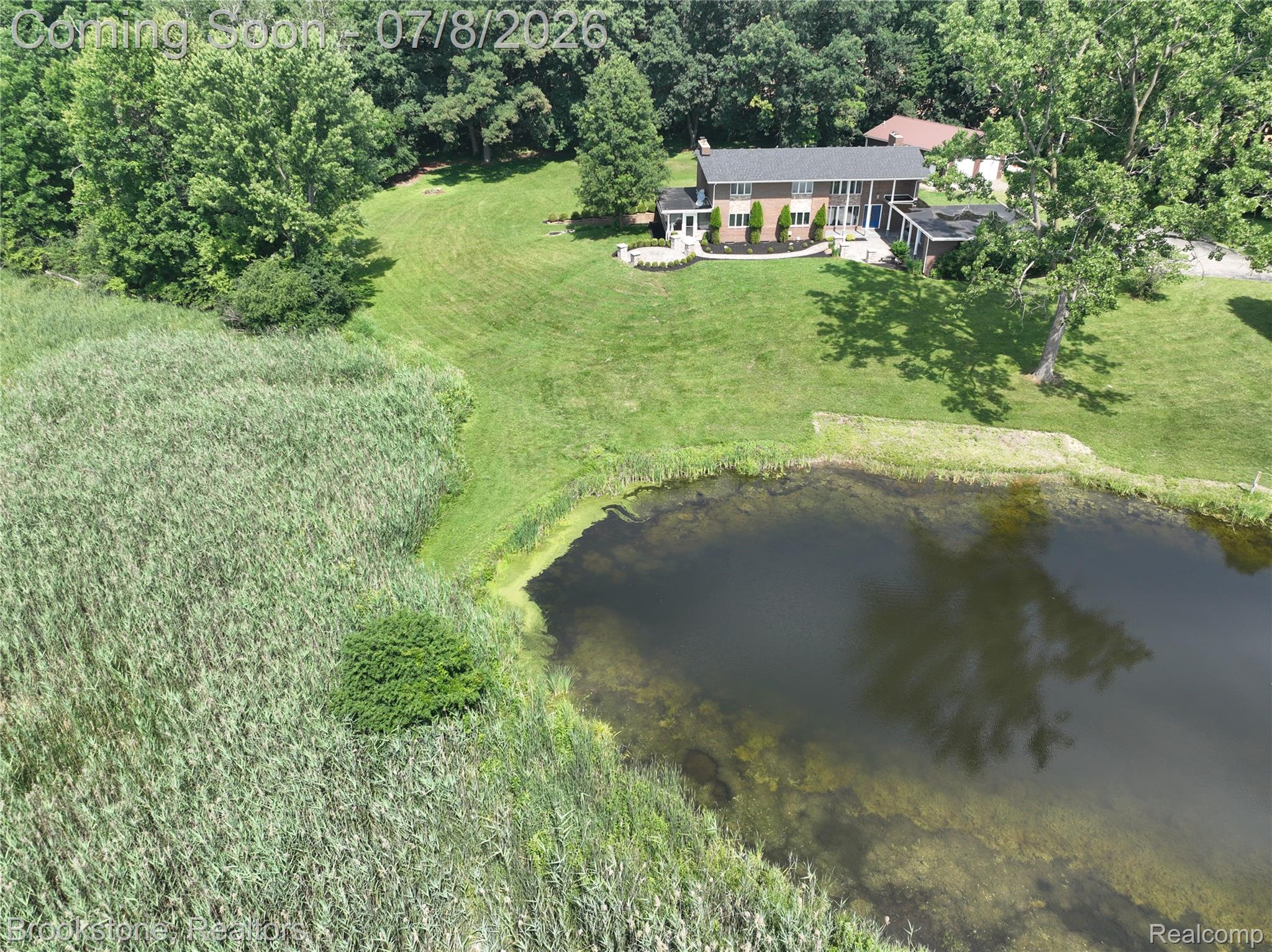 4140 South Henderson Road Davison, MI 48423 - Photo 90 of 98 Expansive property featuring a private pond, mature trees, and a spacious lawn