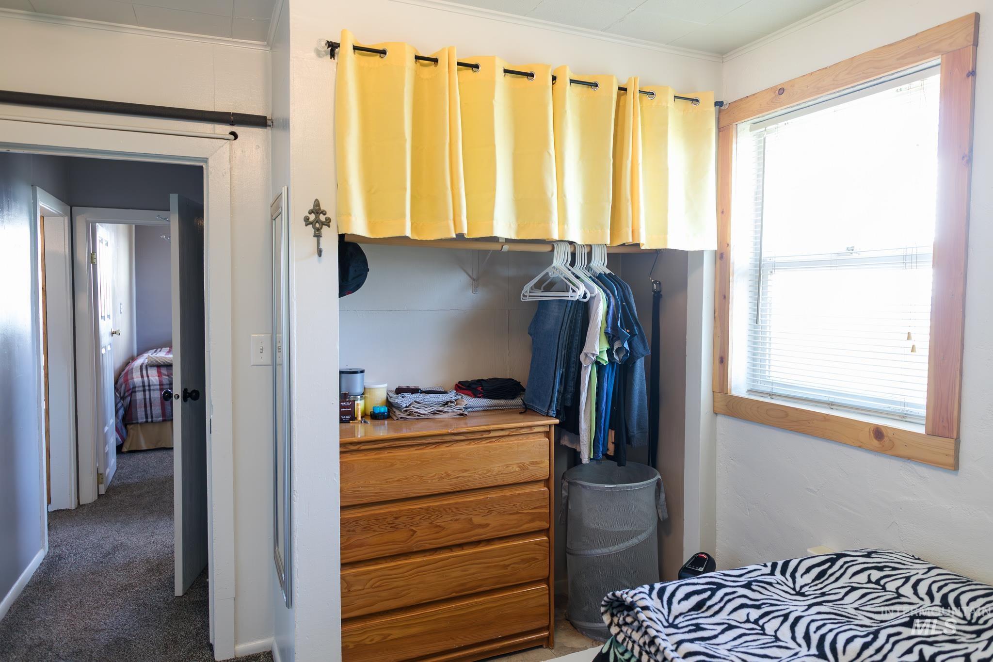 211 Northeast 3rd Avenue Ontario, OR 97914 - Photo 25 of 40 Bedroom featuring crown molding and carpet flooring