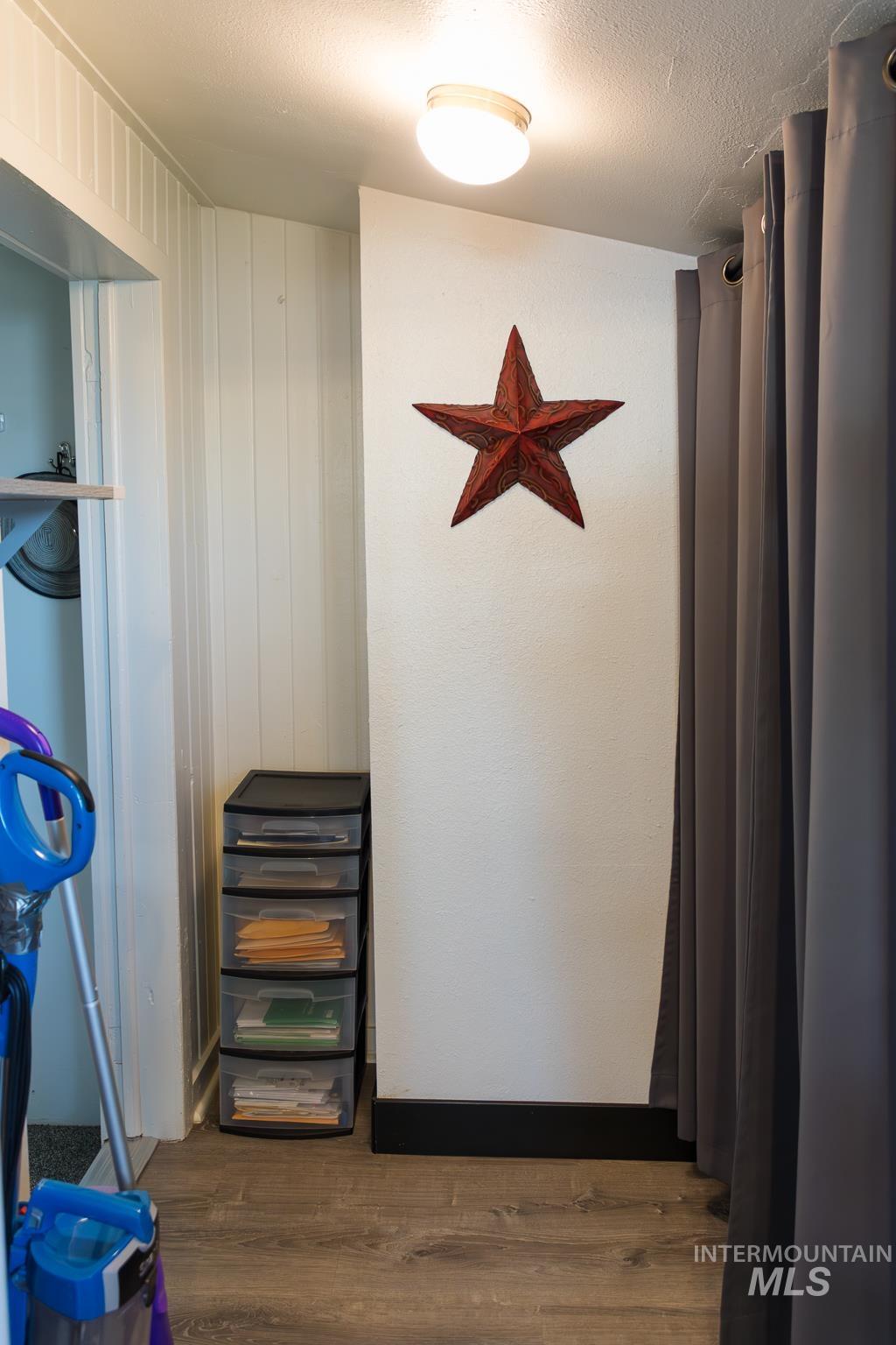 211 Northeast 3rd Avenue Ontario, OR 97914 - Photo 29 of 40 Hall featuring dark wood-type flooring and a textured ceiling