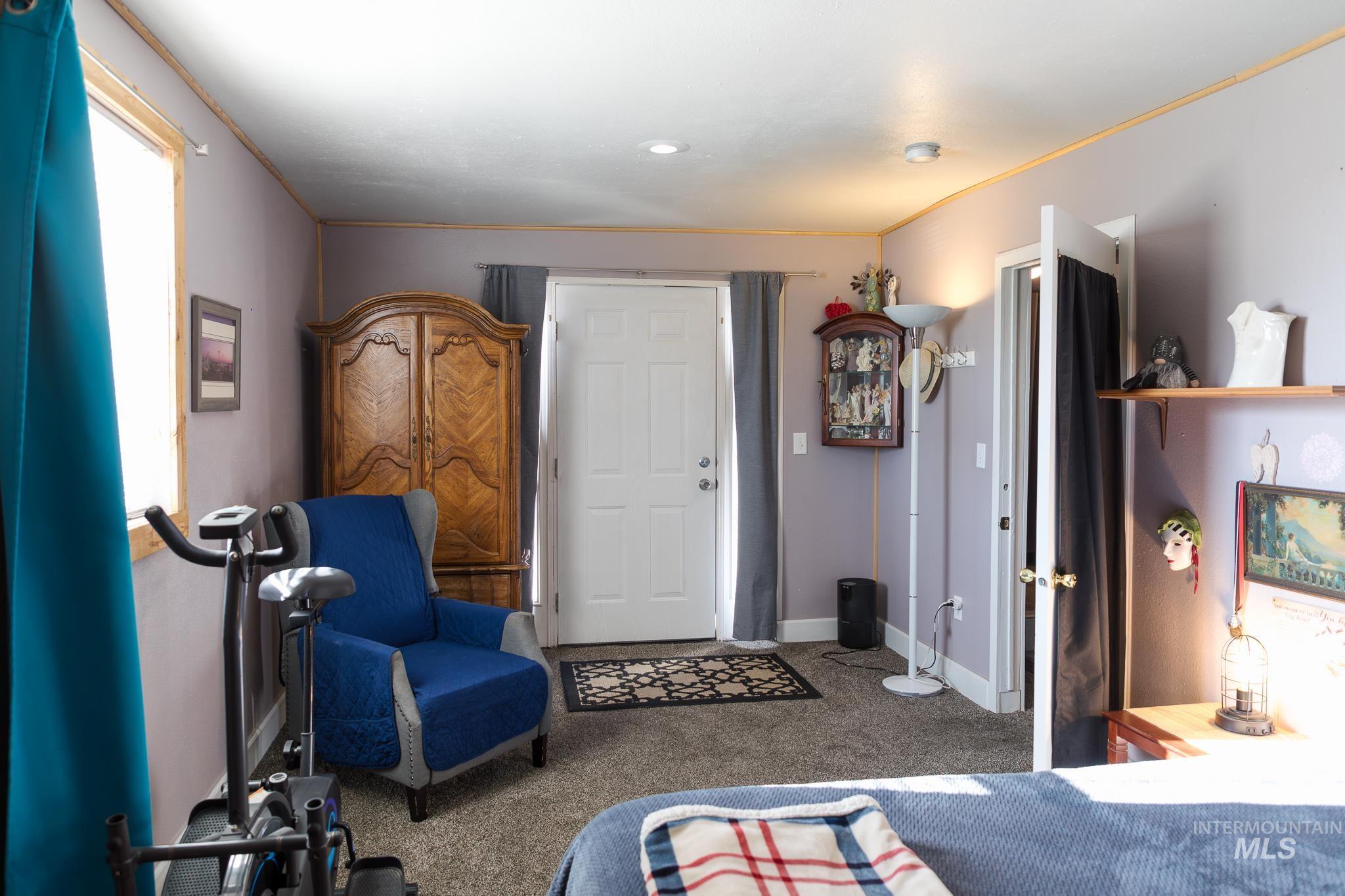 211 Northeast 3rd Avenue Ontario, OR 97914 - Photo 35 of 40 Bedroom featuring light carpet and crown molding