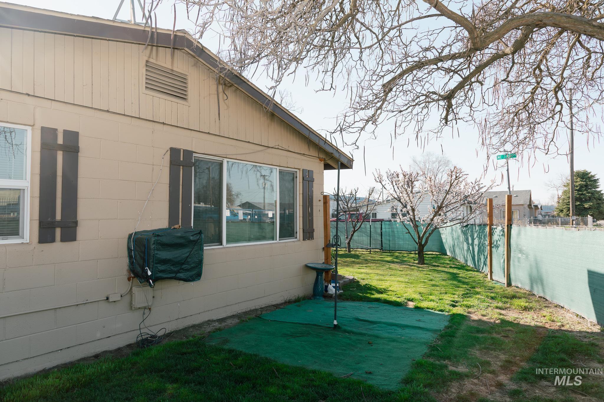 211 Northeast 3rd Avenue Ontario, OR 97914 - Photo 39 of 40 View of property exterior with a fenced backyard and concrete block siding