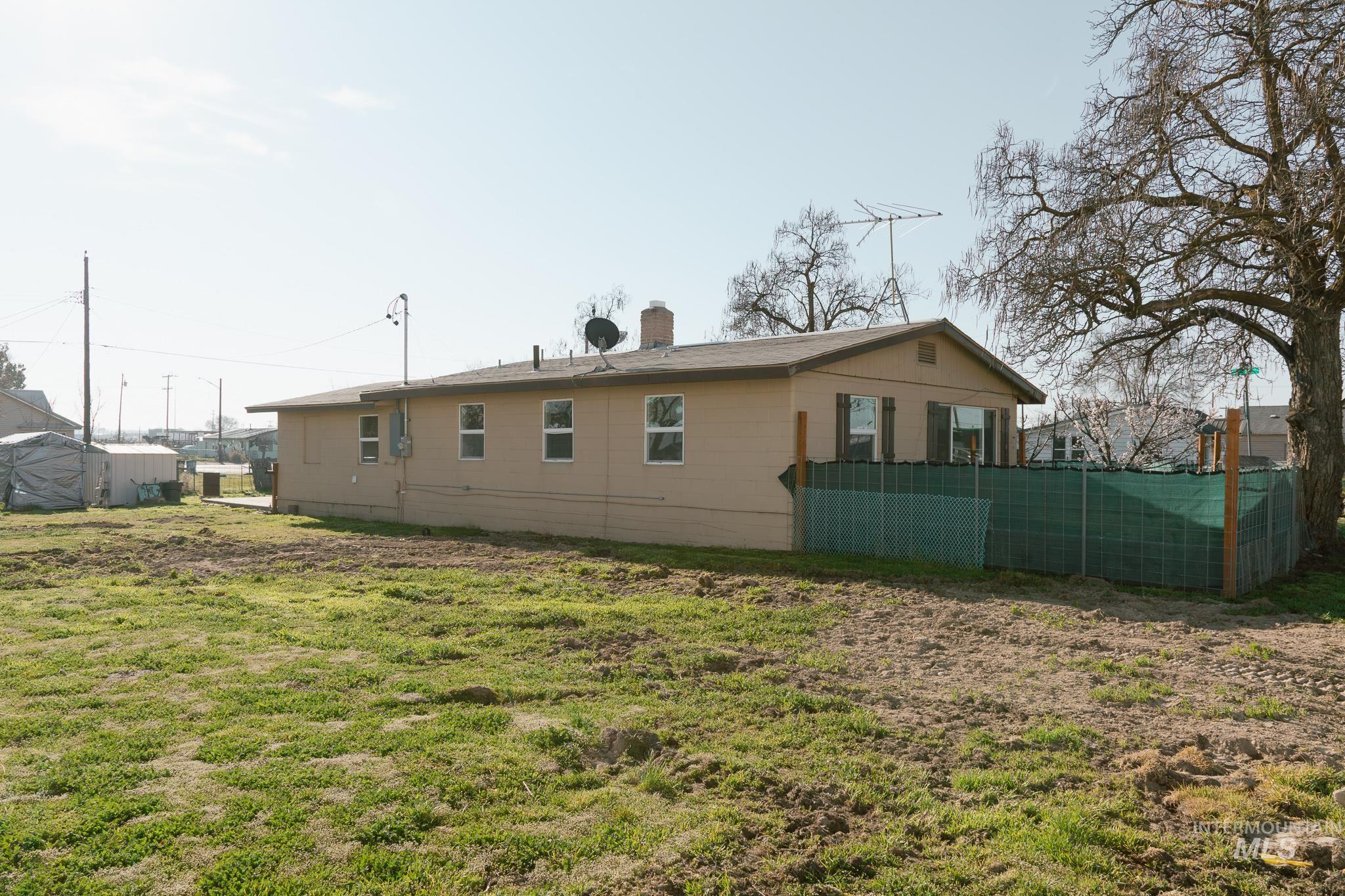 211 Northeast 3rd Avenue Ontario, OR 97914 - Photo 7 of 40 Back of house with a chimney