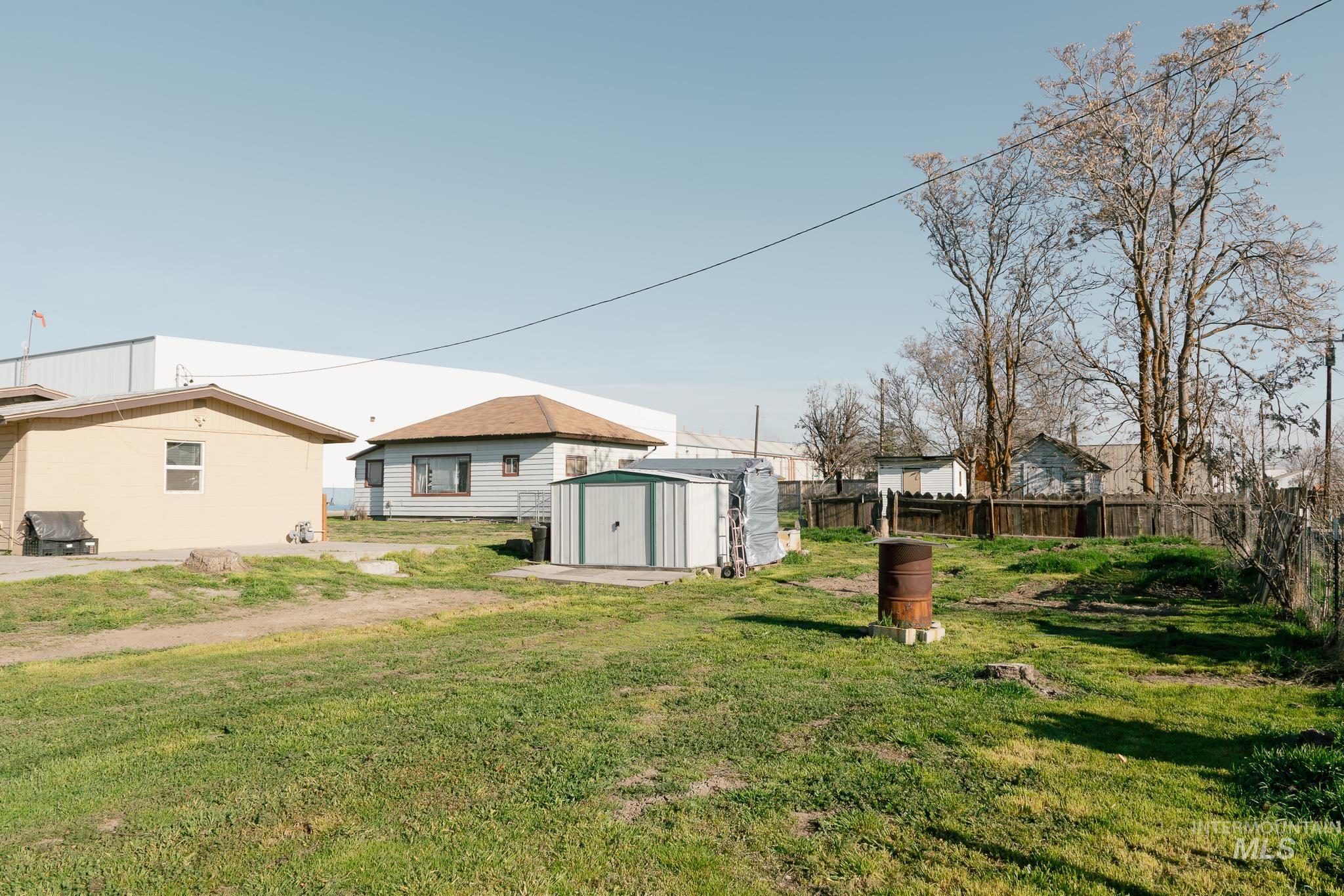 211 Northeast 3rd Avenue Ontario, OR 97914 - Photo 10 of 40 Fenced yard featuring a patio area and a shed