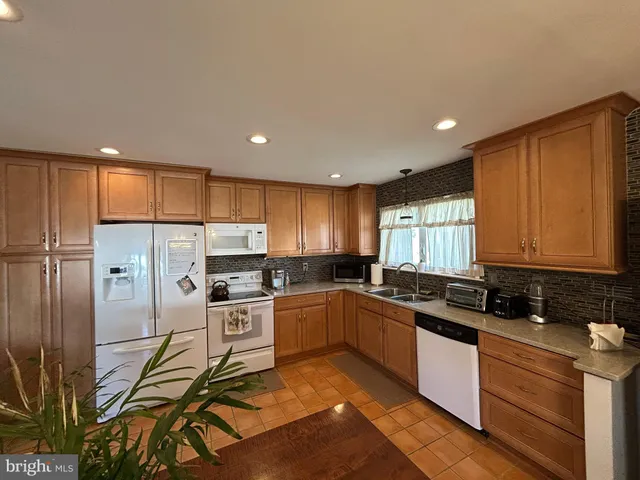 a kitchen with a refrigerator and cabinets