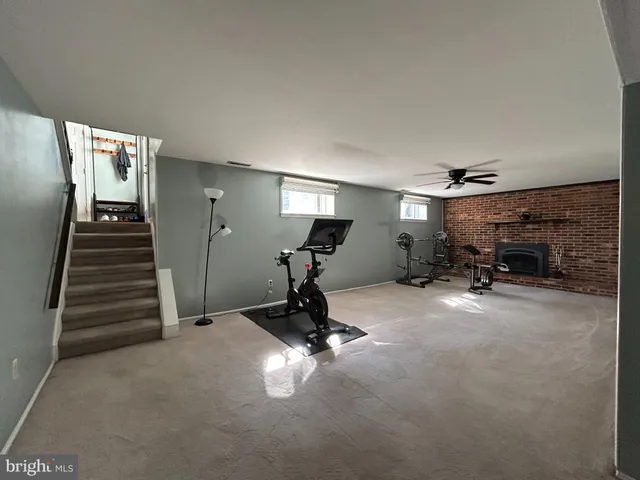 a room with gym equipment and a large window