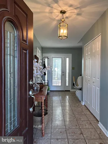 a room with furniture and a chandelier