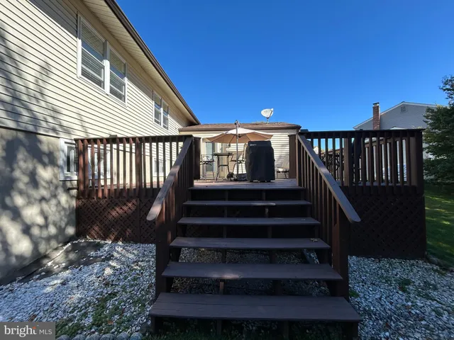 a view of outdoor space with deck and garden
