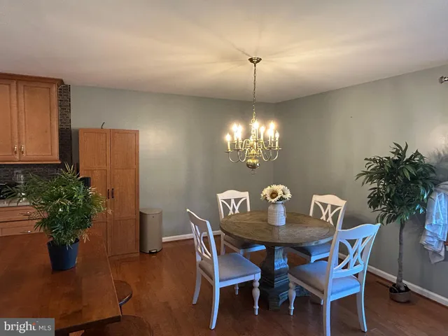 a kitchen with a sink a stove top oven a refrigerator and cabinets