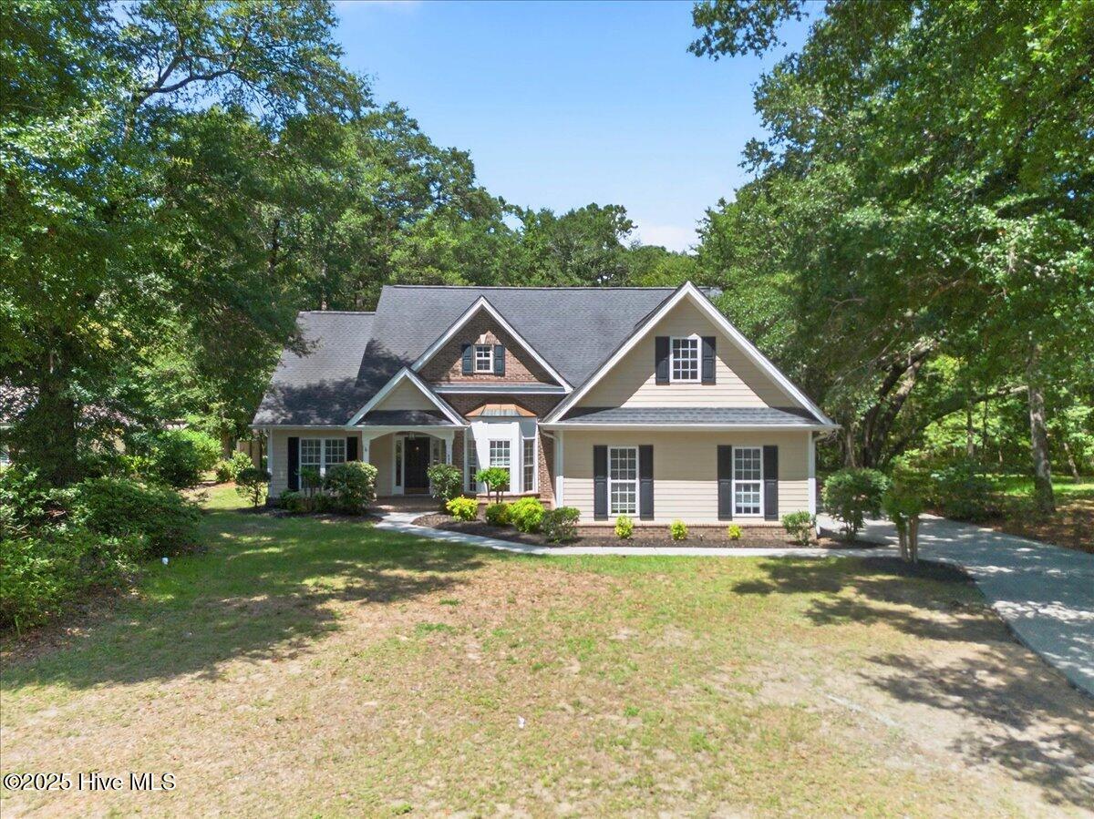 8985 Woodbine Road Southwest Sunset Beach, NC 28468 - Photo 6 of 65 Front exterior