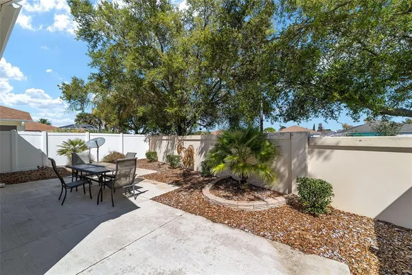 a view of a backyard with sitting area
