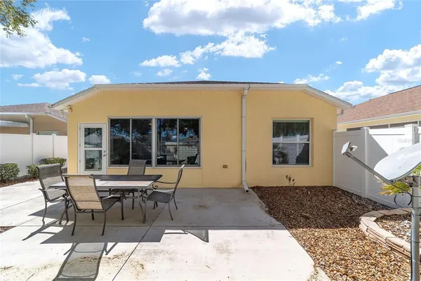 a patio with table and chairs