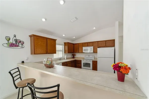 a kitchen with a sink cabinets and stainless steel appliances
