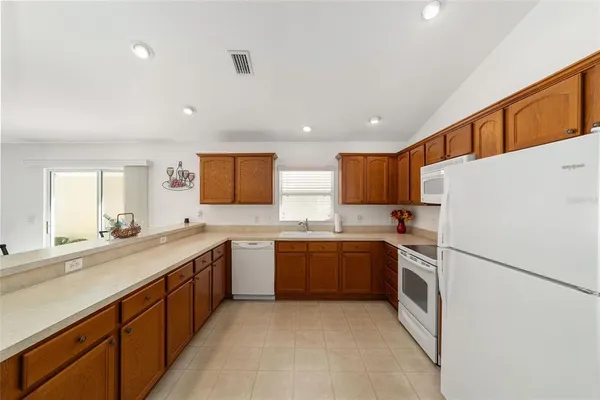 a kitchen with a sink a stove and refrigerator