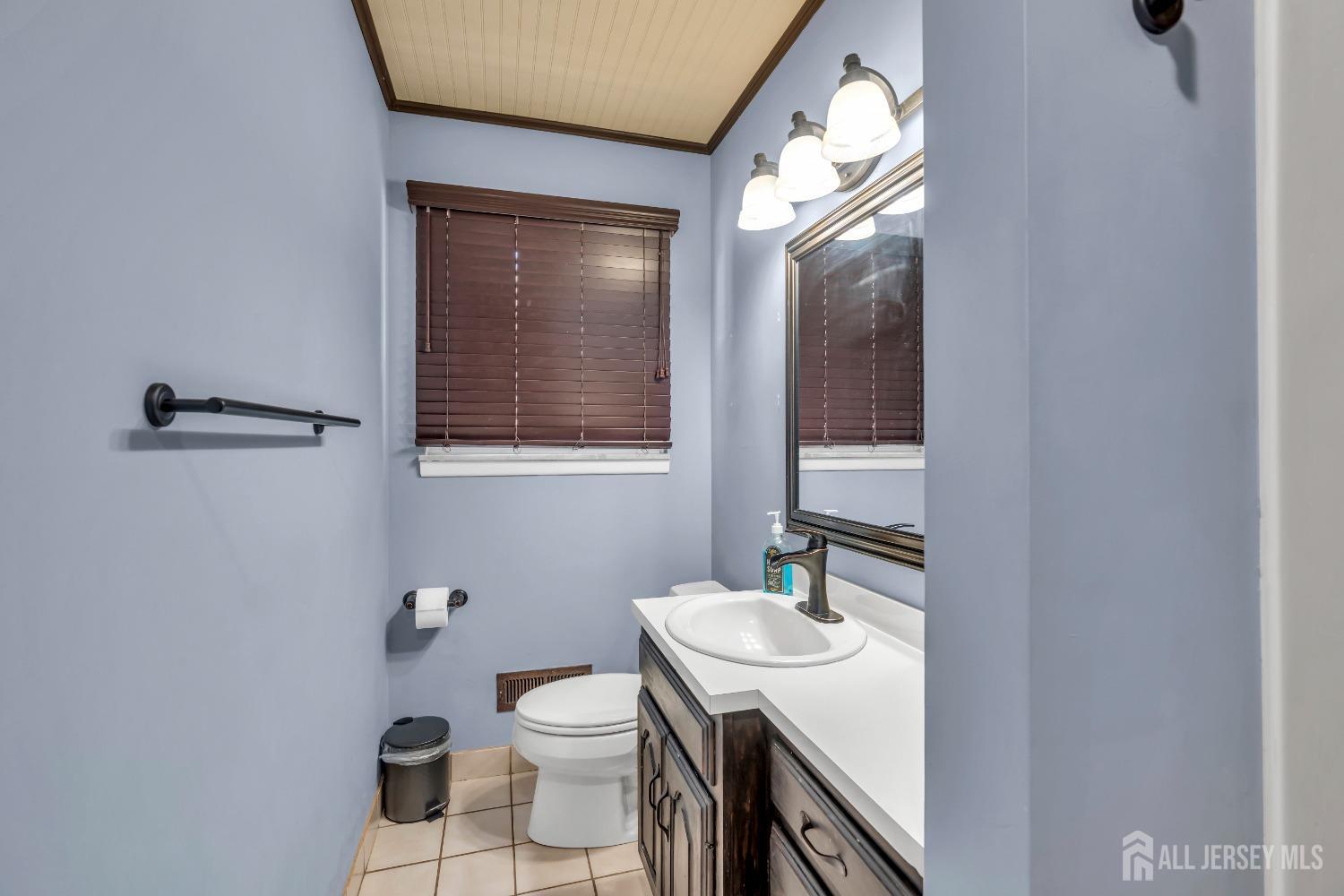27 Brookside Road Edison, NJ 08817 - Photo 13 of 35 a bathroom with a sink toilet and mirror