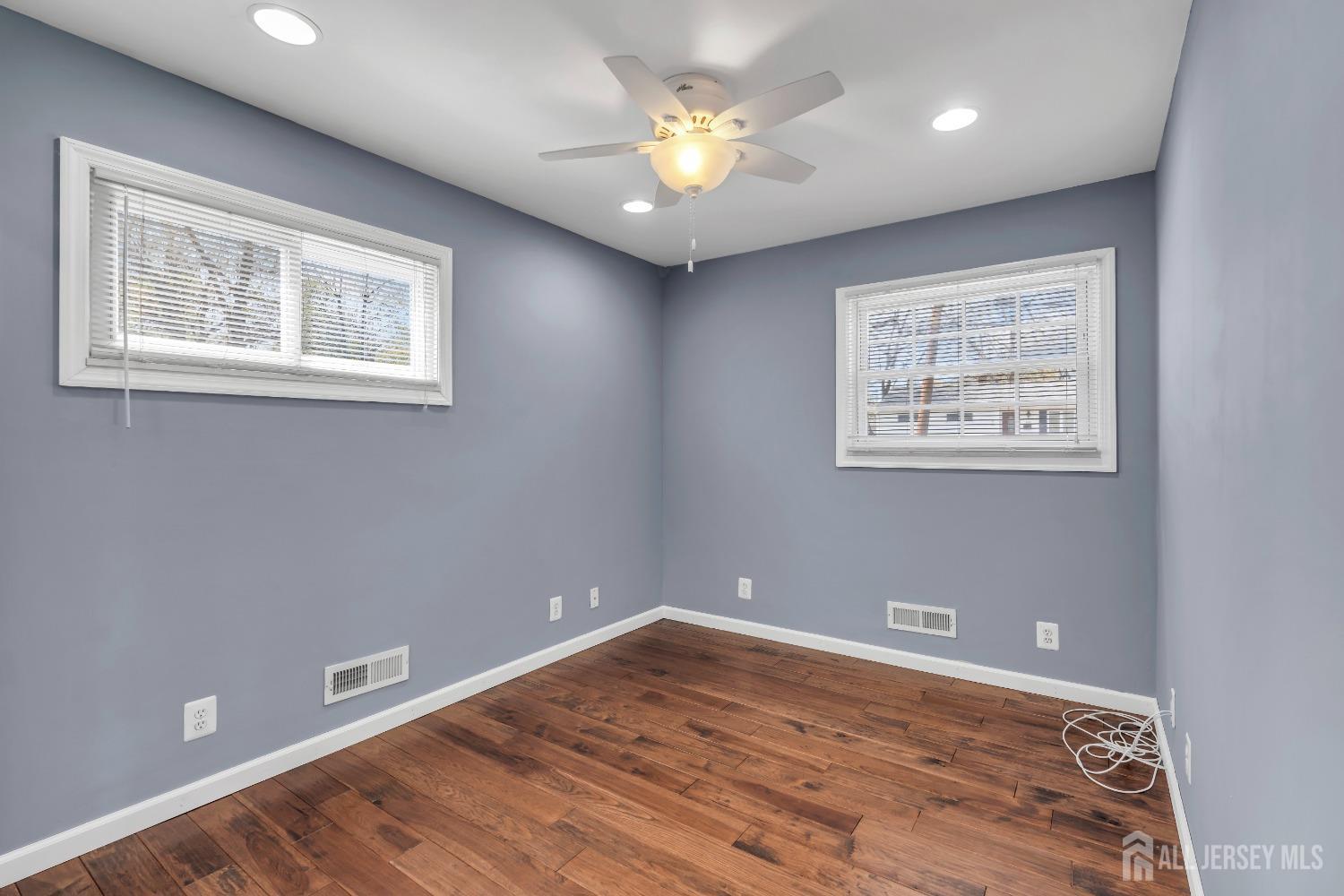 27 Brookside Road Edison, NJ 08817 - Photo 19 of 35 a view of an empty room with window and a ceiling fan