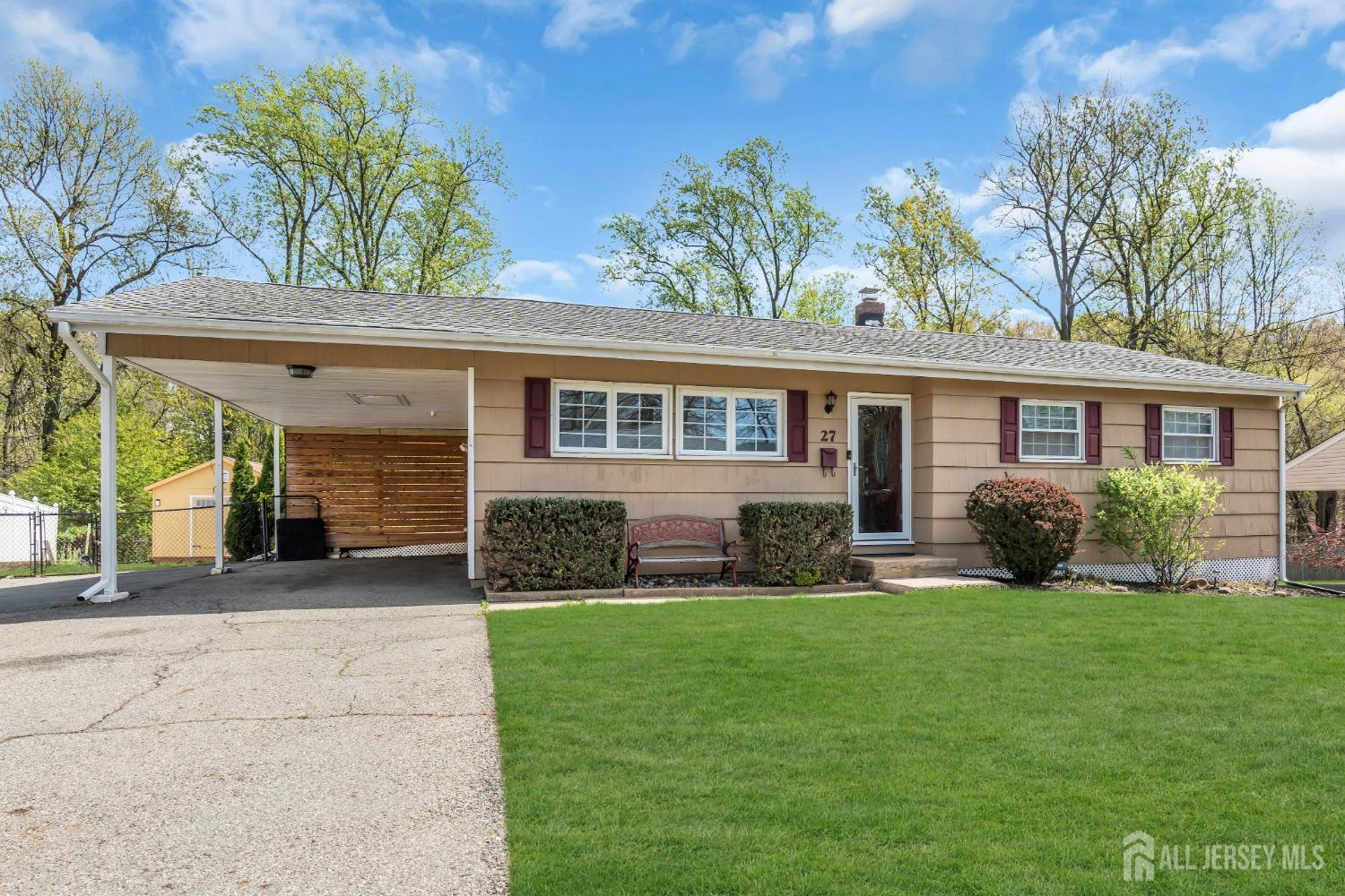 27 Brookside Road Edison, NJ 08817 - Photo 2 of 35 a front view of a house with a yard and potted plants