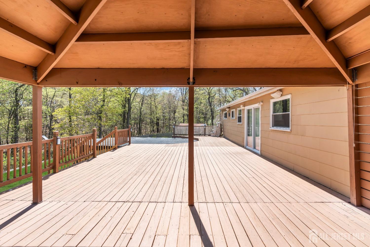 27 Brookside Road Edison, NJ 08817 - Photo 28 of 35 a view of a balcony with wooden floor and iron stairs