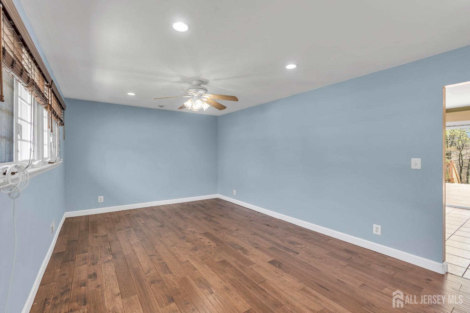 27 Brookside Road Edison, NJ 08817 - Photo 3 of 35 an empty room with wooden floor and windows