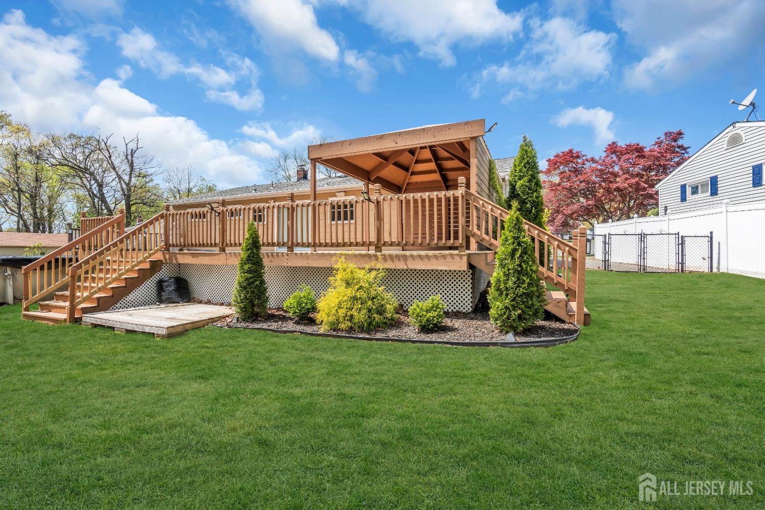 27 Brookside Road Edison, NJ 08817 - Photo 31 of 35 a front view of a house with a yard