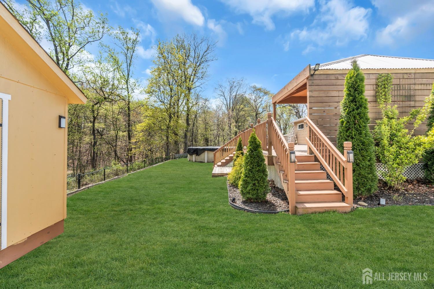 27 Brookside Road Edison, NJ 08817 - Photo 32 of 35 a view of a house with a park