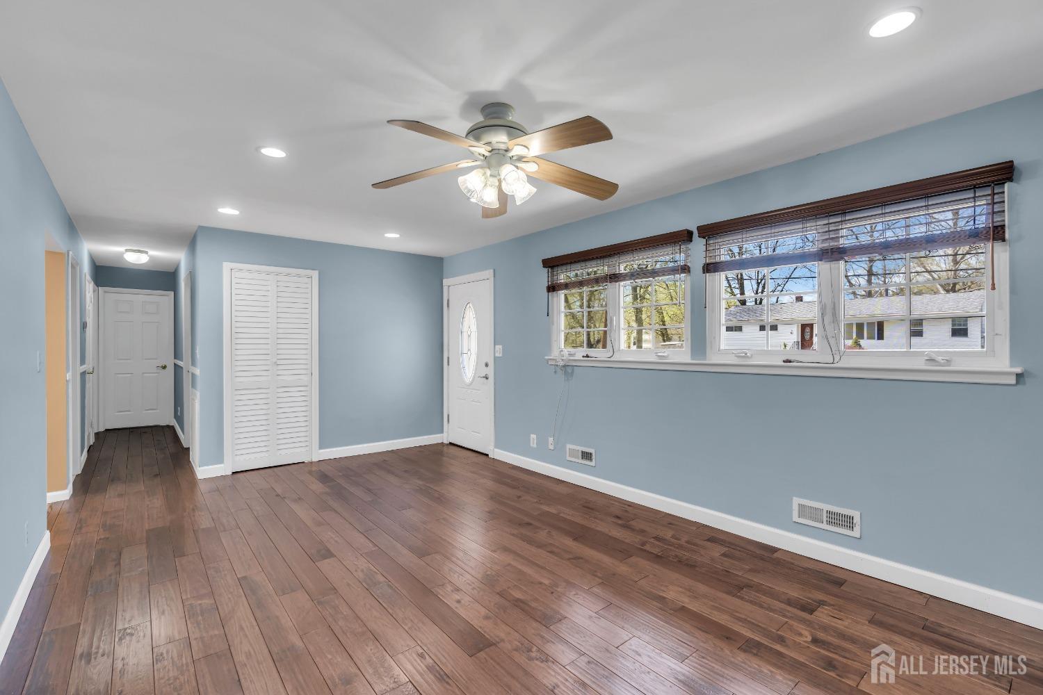 27 Brookside Road Edison, NJ 08817 - Photo 5 of 35 a view of an empty room with wooden floor and a window