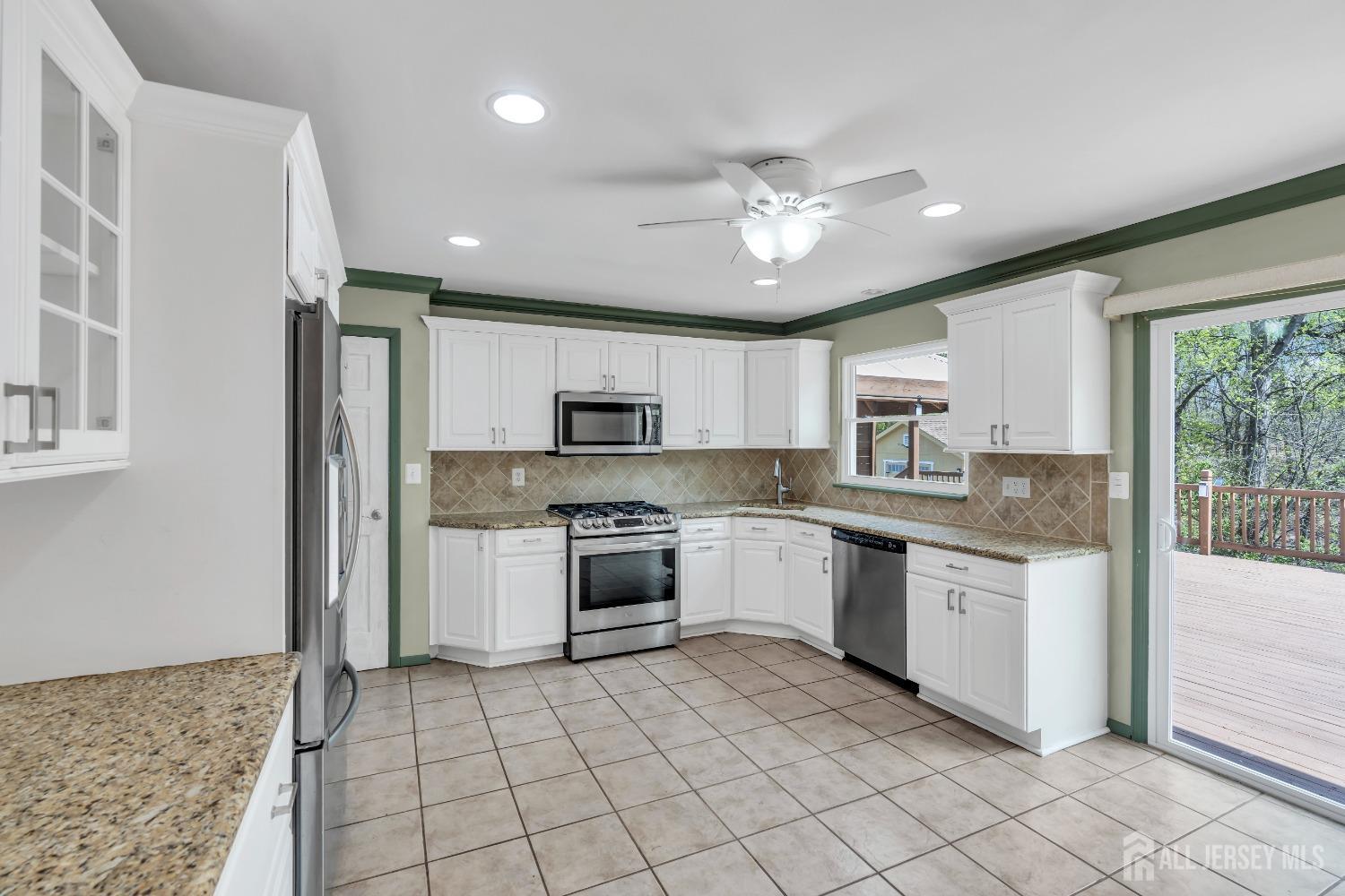 27 Brookside Road Edison, NJ 08817 - Photo 6 of 35 a large kitchen with cabinets