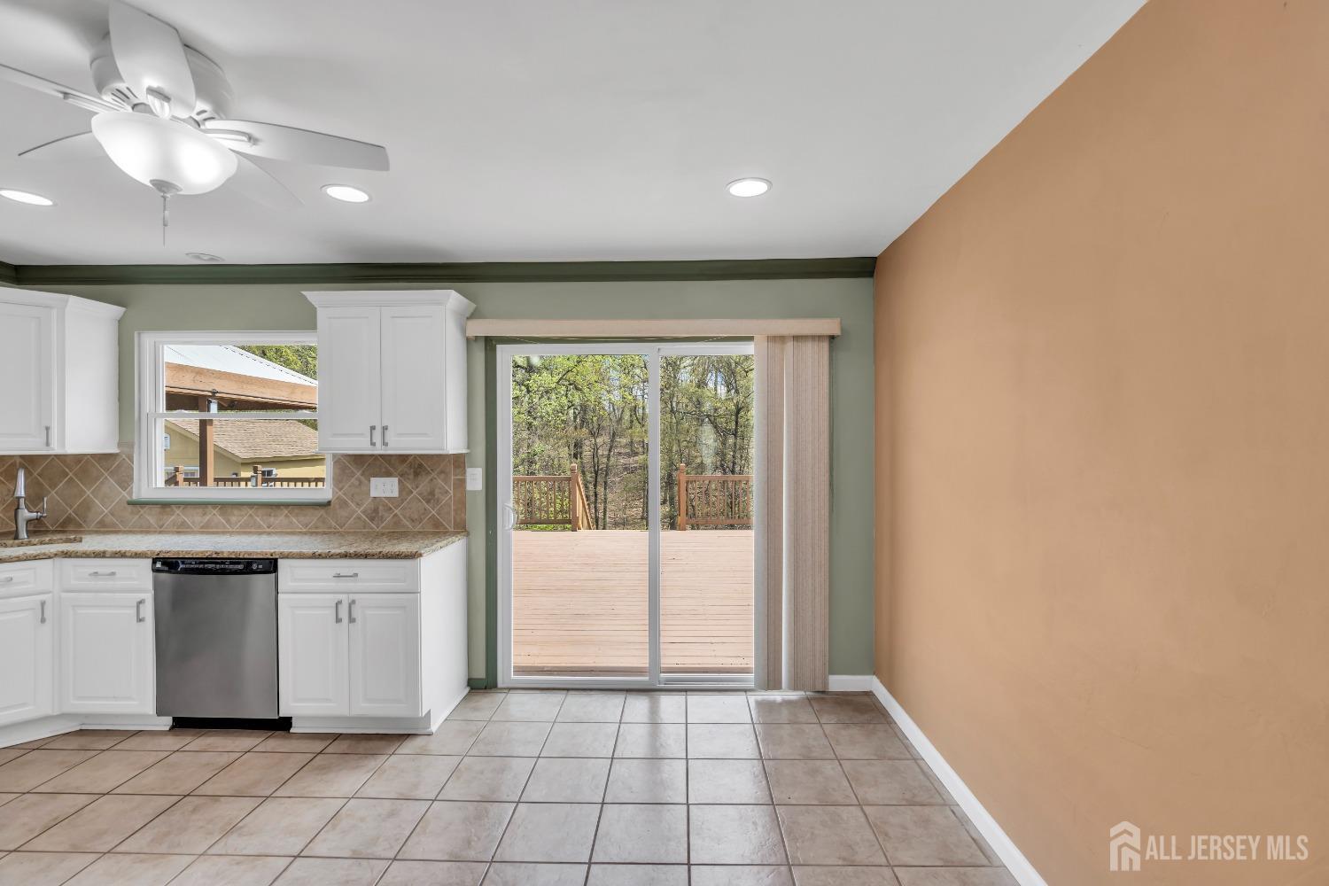 27 Brookside Road Edison, NJ 08817 - Photo 10 of 35 a open kitchen with a sink and dishwasher with a large window