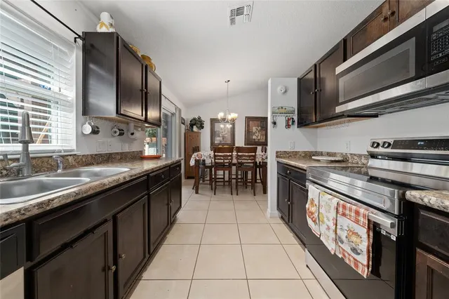 a bedroom with a bed and a chair