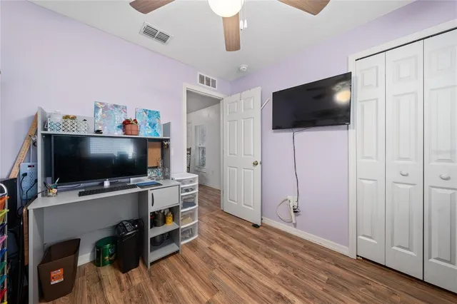 a bedroom with a bed and furniture