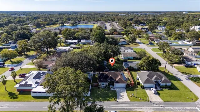 an aerial view of residential house with outdoor space and parking