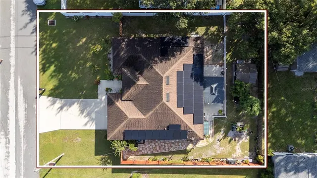 a view of a patio with table and chairs with wooden floor and fence
