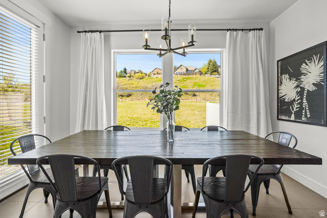 15008 South Springtime Road Draper, UT 84020 - Photo 14 of 37 Dining room with tile patterned floors and a chandelier