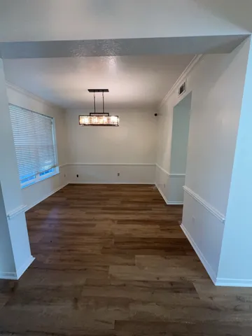 a view of wooden floor in an empty room