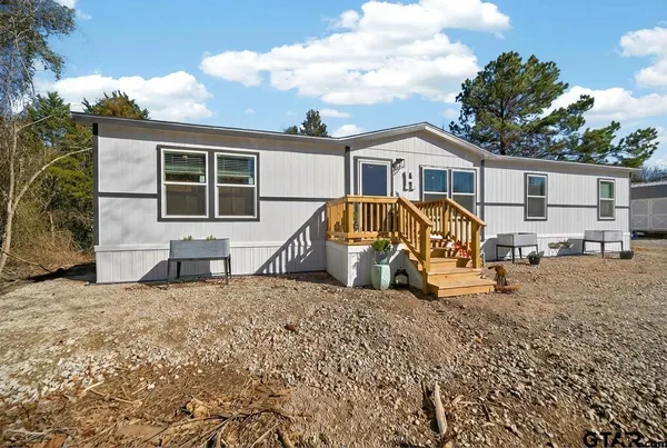 a view of a house with pool porch and furniture