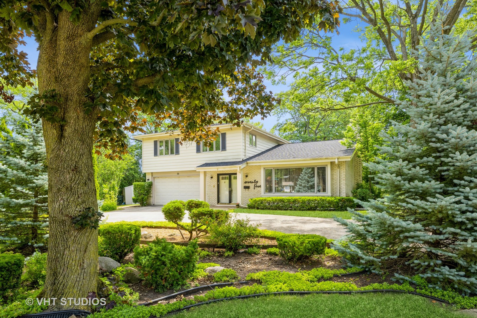a front view of a house with a yard
