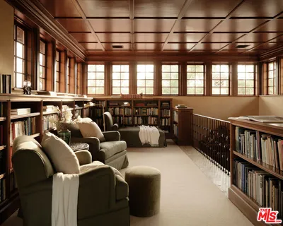 a living room with furniture window and book shelf