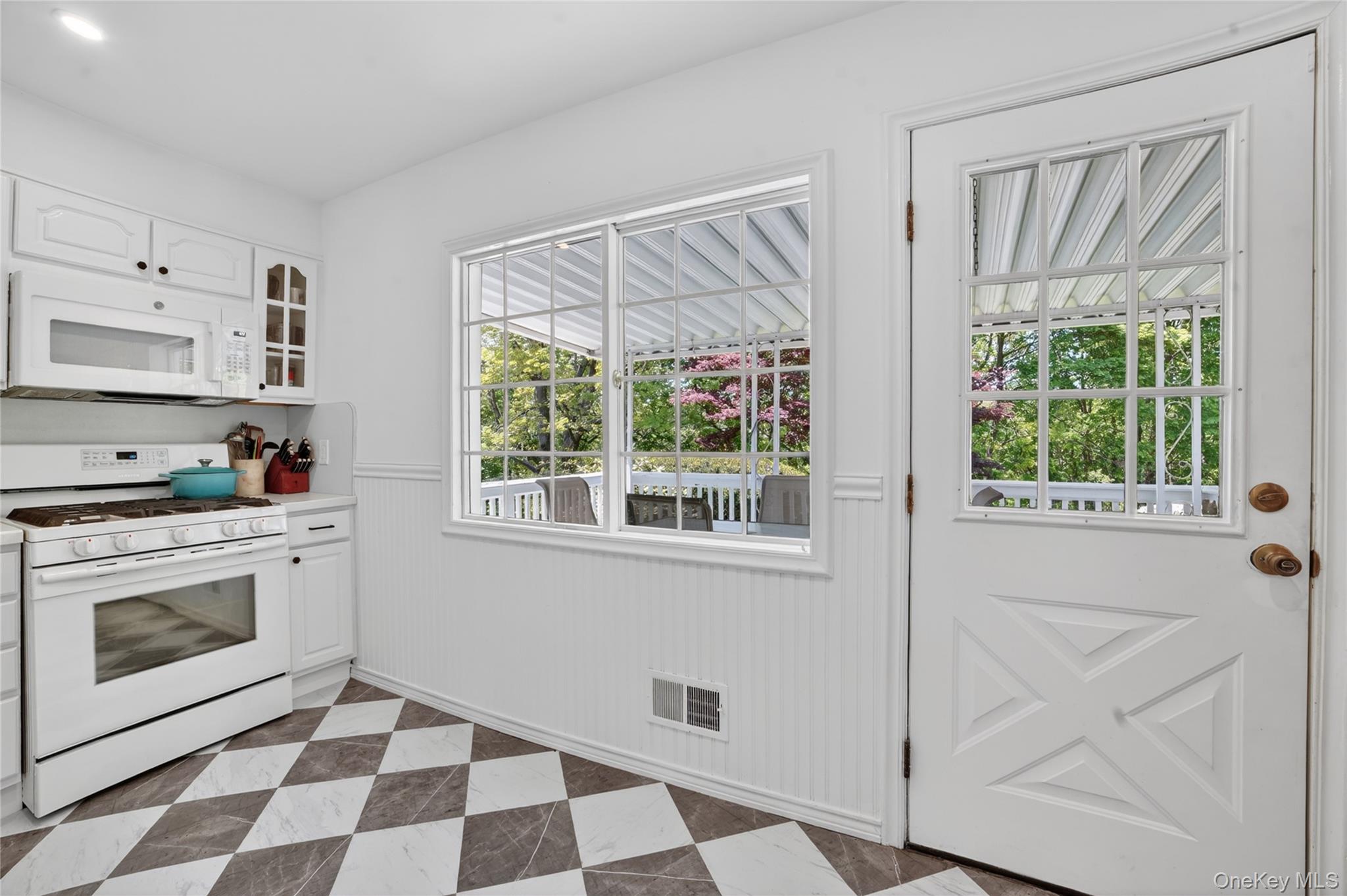 29 Newkirk Road Yonkers, NY 10710 - Photo 11 of 34 a kitchen with a stove a sink and a window