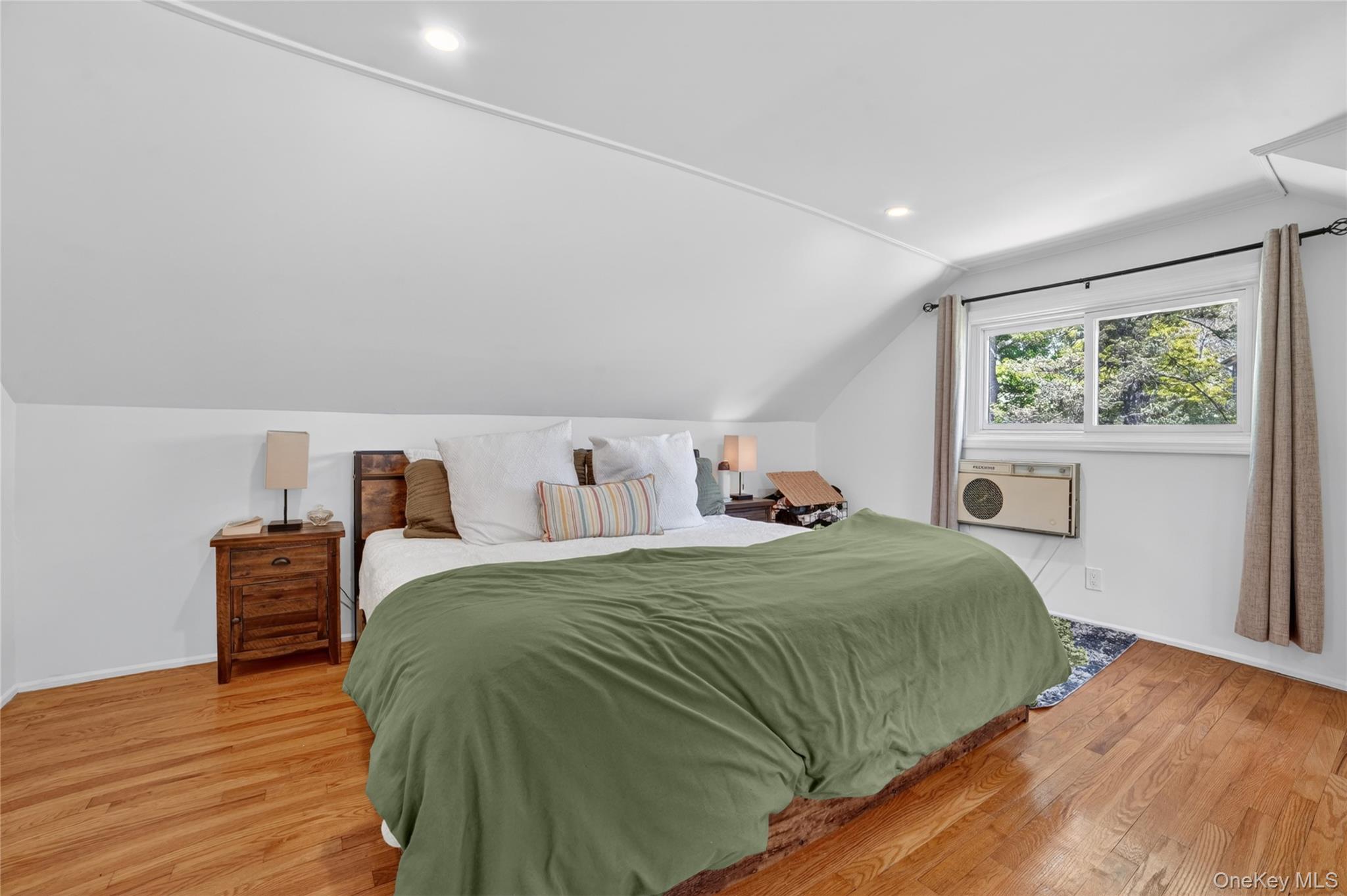 29 Newkirk Road Yonkers, NY 10710 - Photo 15 of 34 a bedroom with a bed window and wooden floor