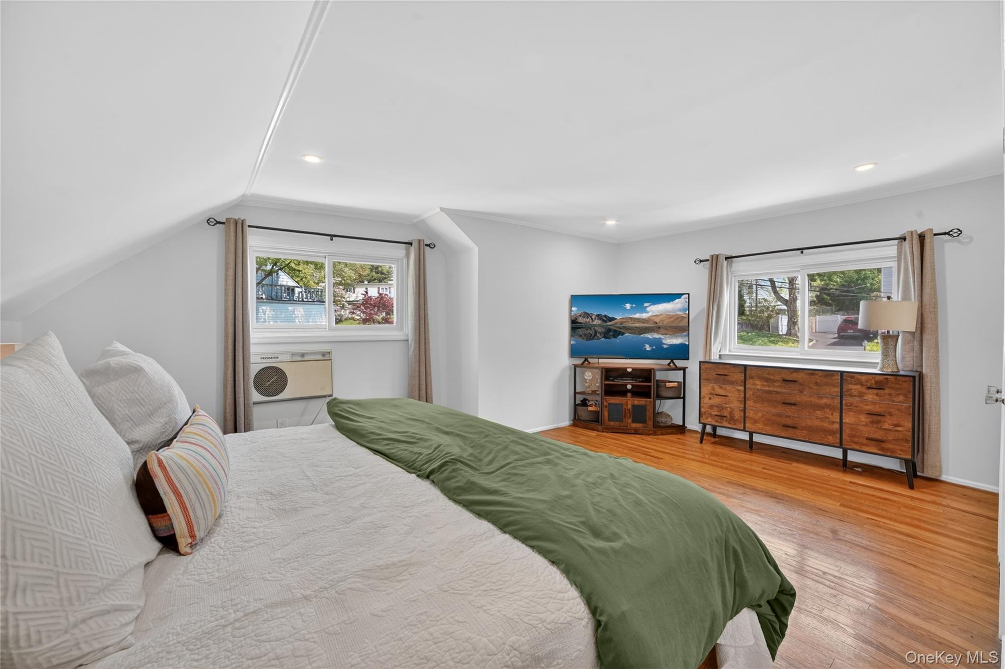 29 Newkirk Road Yonkers, NY 10710 - Photo 16 of 34 a bedroom with furniture and a wooden floor
